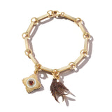 gold book link chain bracelet with two charms garnet bird swallow and garnet medallion