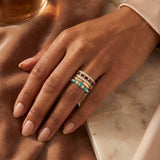 Inspired by stacking rings that mark moments, memories, and milestones, the Strata Ring reflects the way we like to wear our own rings: layered, personal, and gathered over time. Designed as a ready-made stack, it brings together bands set with garnet, diamond, pearl, and turquoise, each adding its own color, texture, and pop of color.