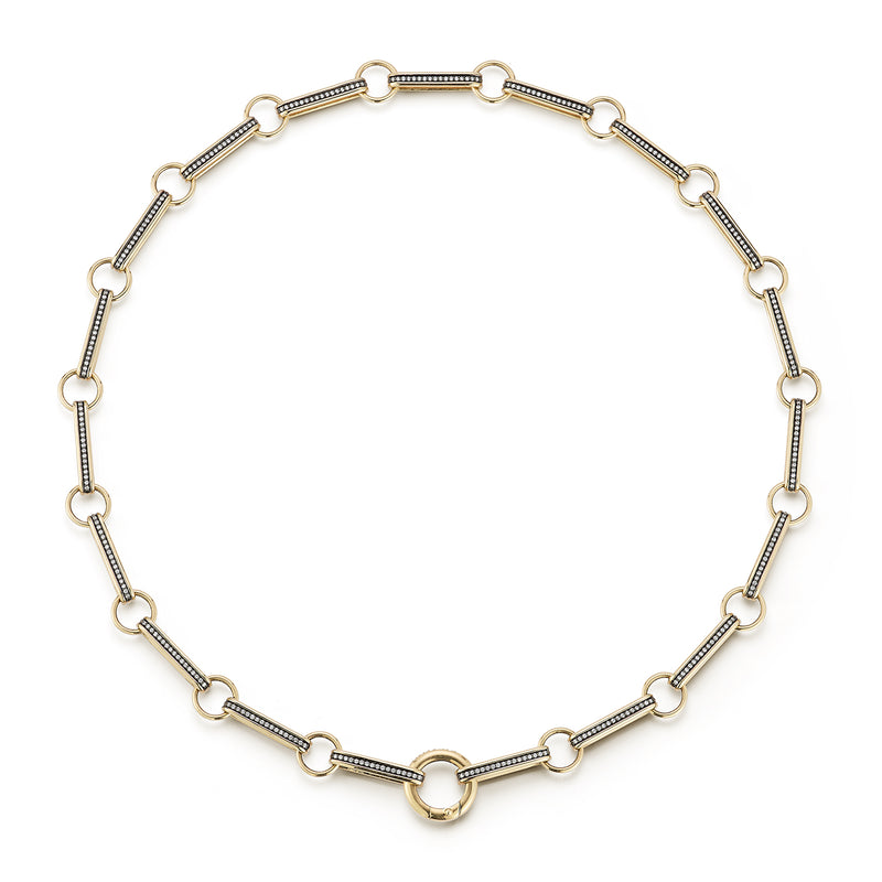 14K Gold Elongated Book Link 16" Diamond Ellis Chain
A Storrow classic, reimagined. This chain showcases elongated book links with a pave diamonds and a sleek rhodium finish that enhances every sparkle. Designed with a push center bail, it’s effortless to personalize with charms or pendants, making it the ultimate versatile chain for layering or everyday wear.
