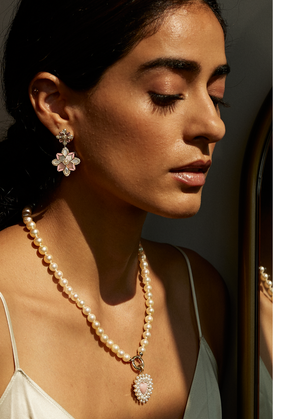 Storrow offers one-of-a-kind fine jewelry gifts to impress that special someone in your life. Our pieces are inspired by the modern day collector, and curated for the everyday wearer. Storrow's charms & medallions are designed to be mixed and matched with our custom chains using our open-clip bail. Style yours today! Styled with delicate pearl accents, heart-shaped pink opal, and mother-of-pearl.